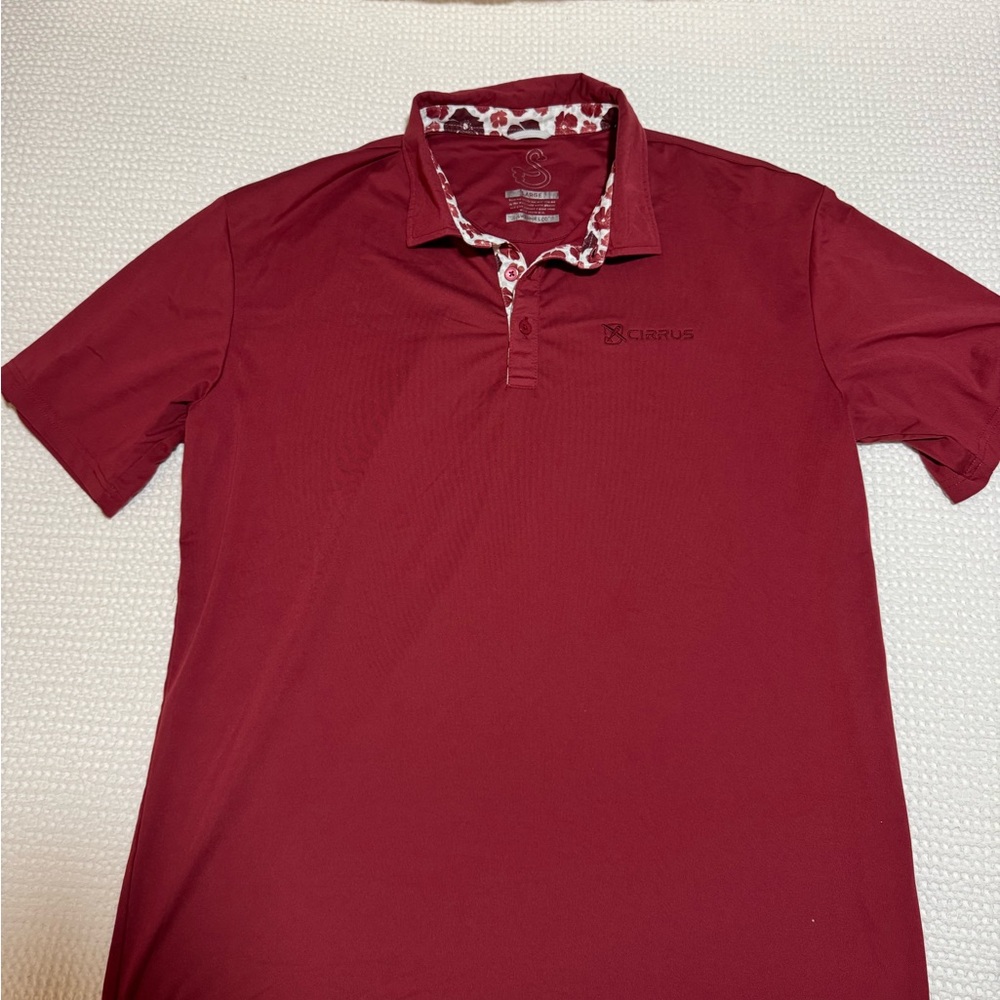 Swannies golf polo with Cirrus Aircraft logo